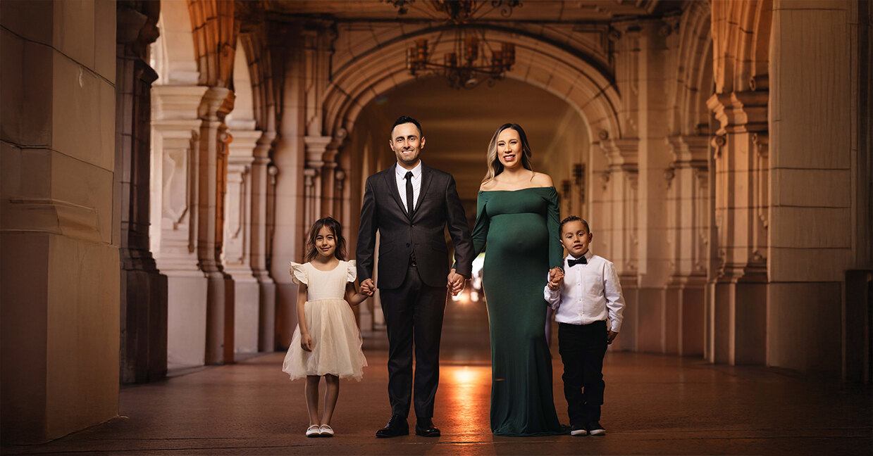 Family portrait in a lantern-lit archway