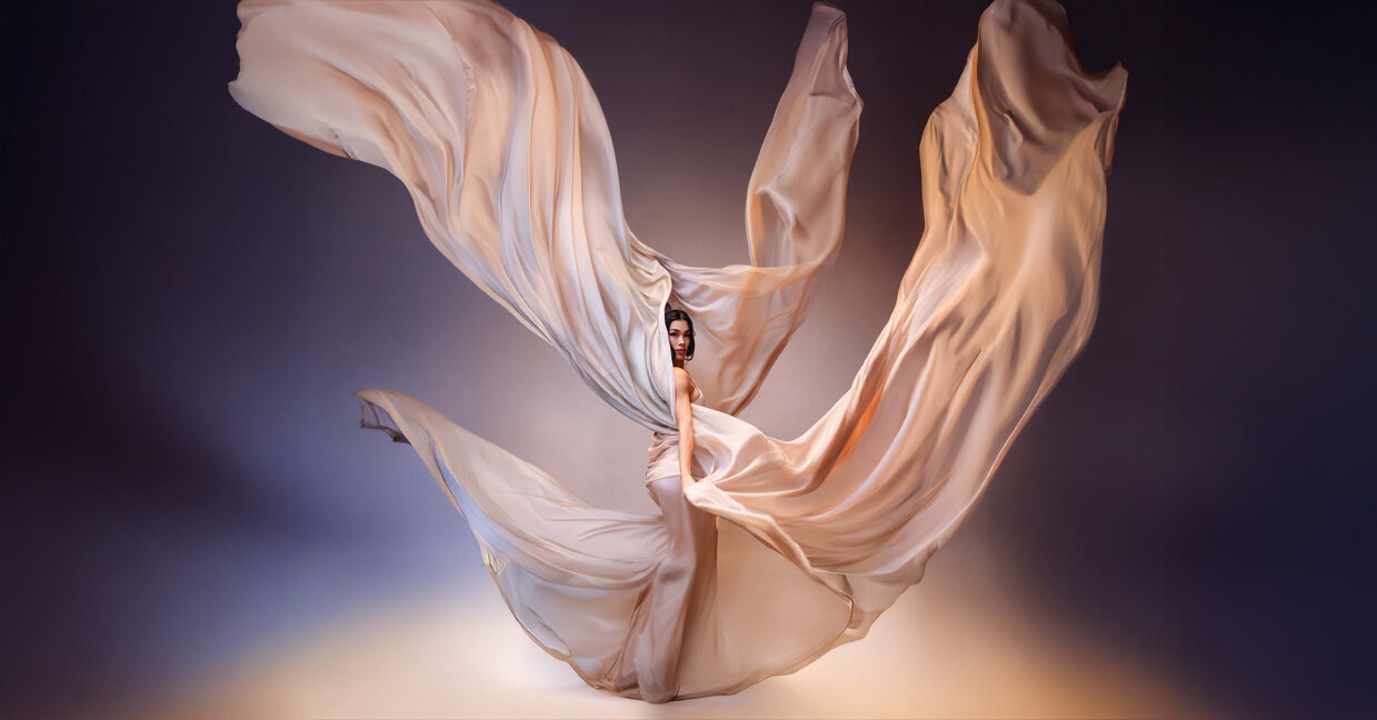 Editorial portrait with flowing silk